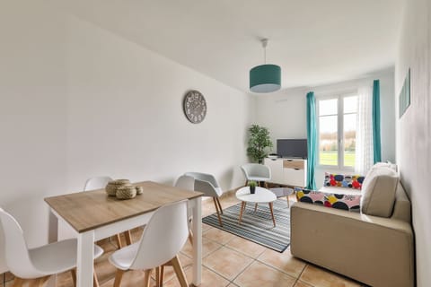 Comfort Apartment, Garden View | Living area | 80-cm flat-screen TV with digital channels, TV