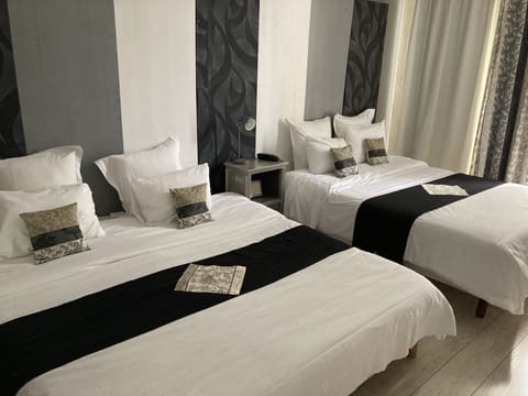 Triple Room | Premium bedding, in-room safe, individually decorated, desk