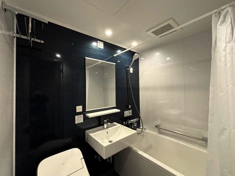 Standard Room | Bathroom | Hair dryer, slippers, bidet, towels