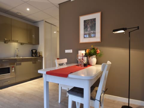 Deluxe Apartment, 1 Bedroom | Private kitchen | Fridge, microwave, coffee/tea maker, highchair