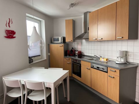 Deluxe Apartment, 2 Bedrooms | Private kitchen | Fridge, microwave, oven, stovetop