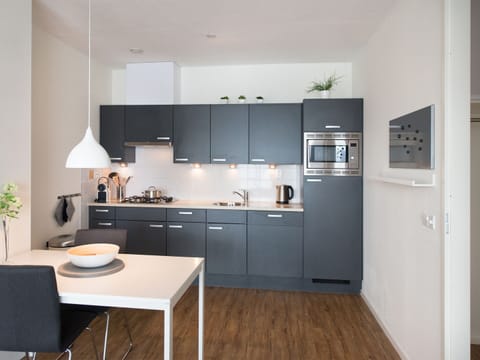 Comfort Apartment, 2 Bedrooms | Private kitchen | Fridge, oven, dishwasher, coffee/tea maker