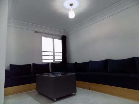 Comfort Apartment, Beach View | Living area | Flat-screen TV