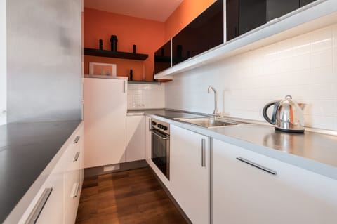 Grand Apartment, 1 Bedroom, Balcony, Courtyard View | Private kitchenette | Stovetop, electric kettle, griddle, cookware/dishes/utensils