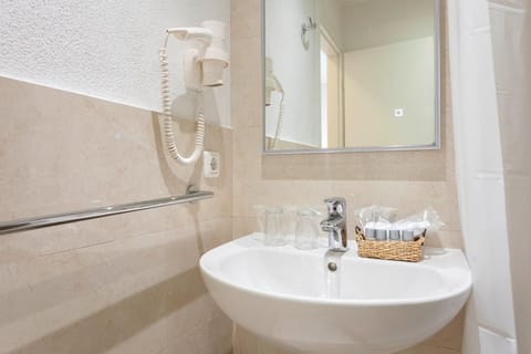 Standard Double Room, Balcony | Bathroom | Shower, hair dryer, towels, soap