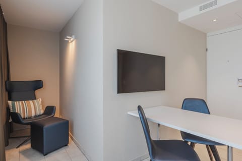 Comfort Double Room | Living area | 32-inch LED TV with cable channels