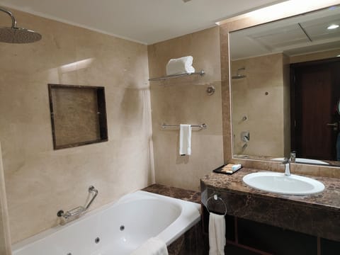 Eco-friendly toiletries, hair dryer, slippers, towels