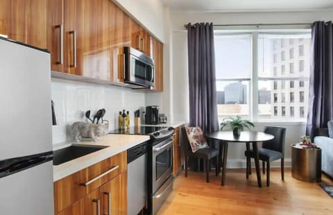 Premier Condo, 1 Bedroom, Kitchen, City View | Living area | 50-inch Smart TV with digital channels, streaming services