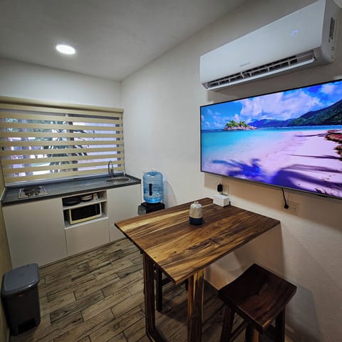 Apartment, Pool View | Private kitchen | Mini-fridge, microwave, stovetop, cookware/dishes/utensils