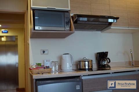 Mini-fridge, microwave, coffee/tea maker, electric kettle