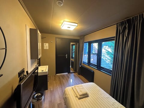 Single Room, Private Bathroom | In-room safe, desk, laptop workspace, blackout drapes