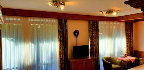 Triple Room | Living area | TV