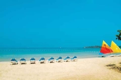 Private beach, white sand, sun loungers, beach umbrellas