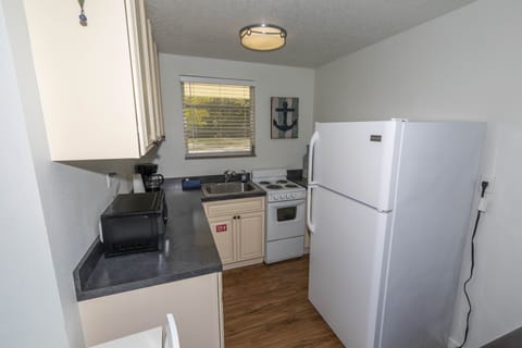 Standard Room, 2 Queen Beds, Non Smoking | Private kitchen | Full-size fridge, microwave, oven, coffee/tea maker