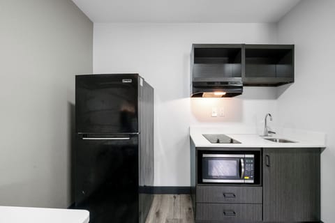 Studio, 1 Queen Bed | Private kitchen | Full-size fridge, microwave, stovetop