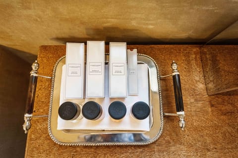 Designer toiletries, hair dryer, bathrobes, slippers