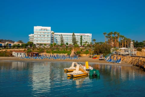 On the beach, white sand, sun loungers, beach umbrellas