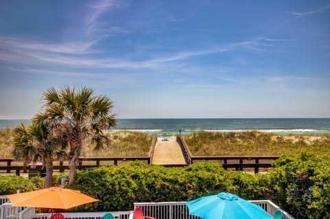 On the beach, white sand, sun loungers, beach umbrellas