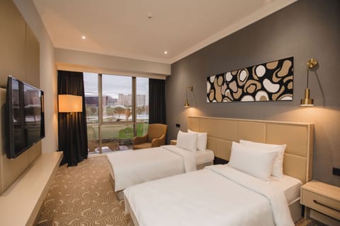 Deluxe Room | Premium bedding, minibar, individually furnished, desk