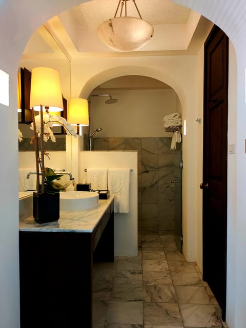 Suite (Min. Age 12 years old) | Bathroom | Shower, rainfall showerhead, free toiletries, slippers