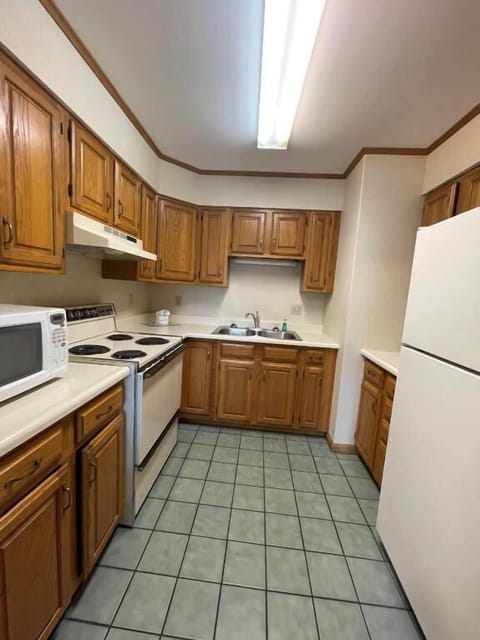 Family Condo | Private kitchen | Fridge, microwave