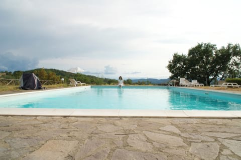 Seasonal outdoor pool, open 8:00 AM to 8:00 PM, pool umbrellas