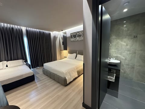 Family Room, 1 Bedroom | 1 bedroom, Egyptian cotton sheets, premium bedding, minibar