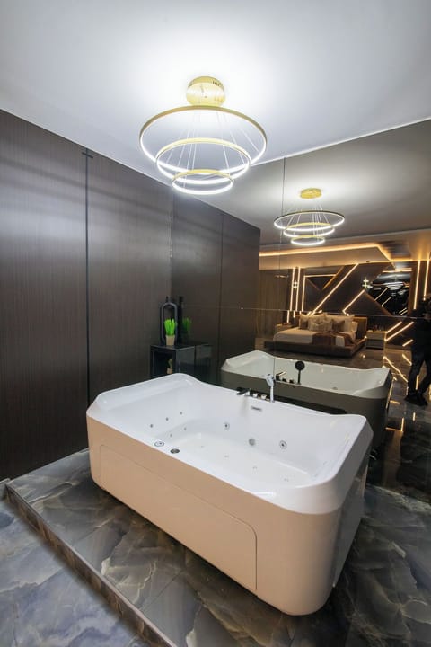 Economy Room, Balcony, Pool View | Bathroom | Separate tub and shower, towels, soap, shampoo