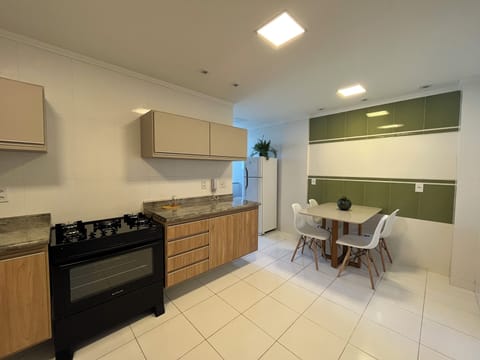 Deluxe Apartment, Balcony, Sea View | Private kitchen | Full-size fridge, microwave, oven, highchair