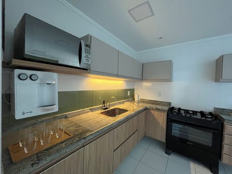 Deluxe Apartment, Balcony, Sea View | Private kitchen | Full-size fridge, microwave, oven, highchair