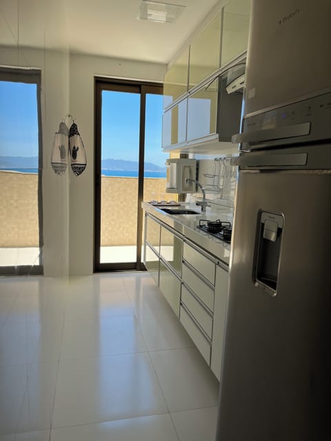 Luxury Apartment, Beach View | Private kitchen | Full-size fridge, oven, stovetop, cookware/dishes/utensils