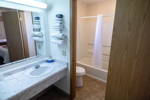 Double Room, 2 Queen Beds, Non Smoking | Bathroom | Combined shower/tub, hair dryer, towels, soap