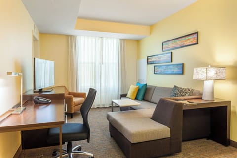 Suite, 2 Bedrooms | Living room | 40-inch LED TV with cable channels, TV