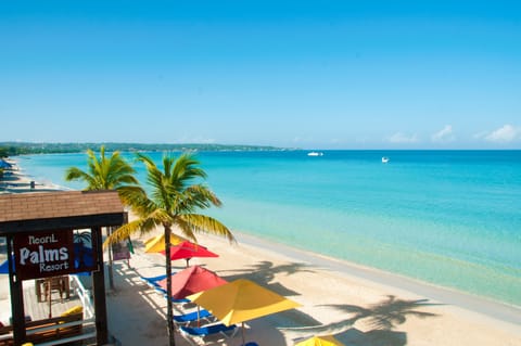 On the beach, sun loungers, beach umbrellas, beach towels