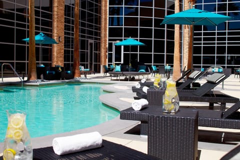 Outdoor pool, open 6:00 AM to midnight, pool umbrellas, sun loungers