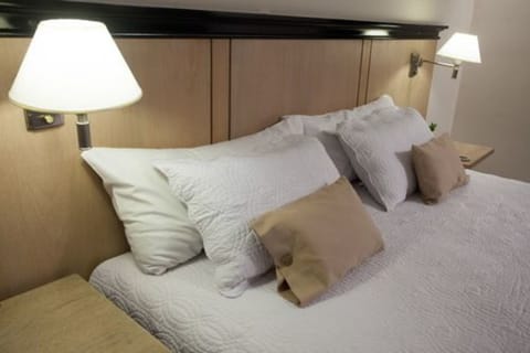 Premium bedding, down comforters, minibar, in-room safe