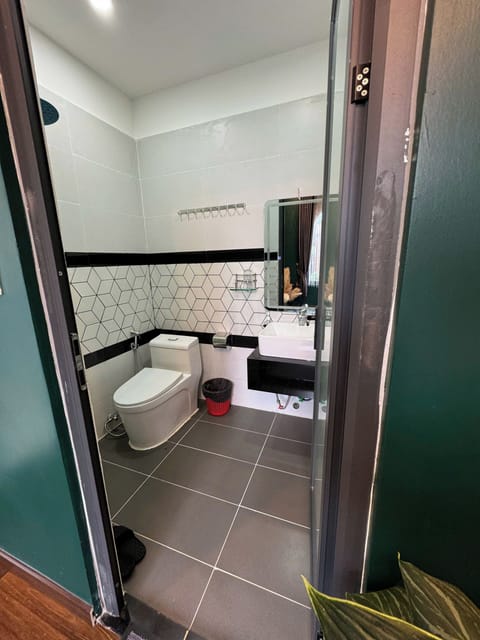 Basic Double Room Single Use | Bathroom | Shower, hair dryer, slippers, towels