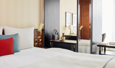 Premium bedding, down comforters, free minibar, in-room safe