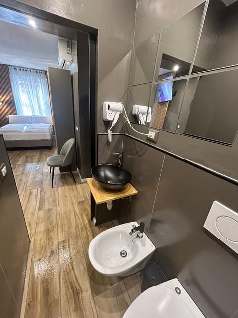 Double Room, City View | Blackout drapes, iron/ironing board, free WiFi