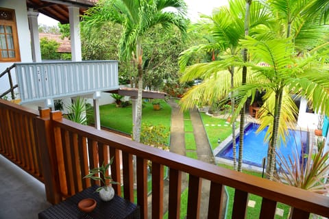 Deluxe Triple Room, Balcony, Pool View | Terrace/patio