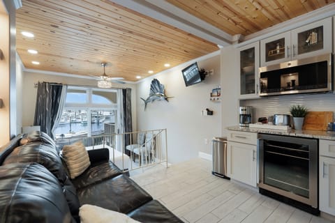 Standard Studio, Balcony, Harbor View | Living area | 40-inch TV with cable channels