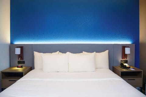 Desk, laptop workspace, blackout drapes, iron/ironing board