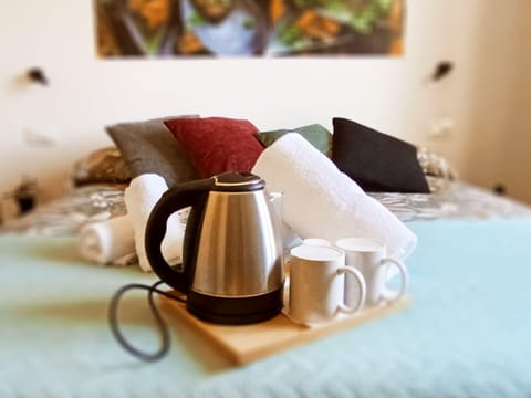 Comfort Triple Room, City View | Down comforters, in-room safe, individually decorated