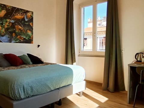 Comfort Triple Room, City View | Down comforters, in-room safe, individually decorated
