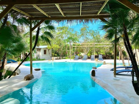 Outdoor pool, open 7:00 AM to 10:00 AM, free cabanas, pool umbrellas