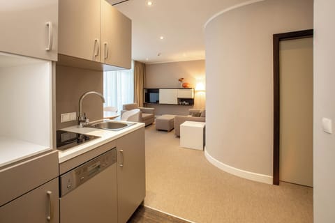 Family Suite | Living area | 35-inch flat-screen TV with cable channels