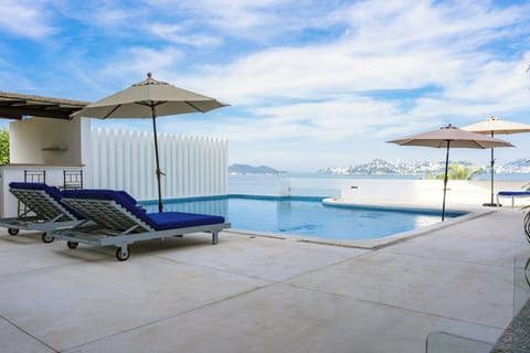 Outdoor pool, pool umbrellas, sun loungers