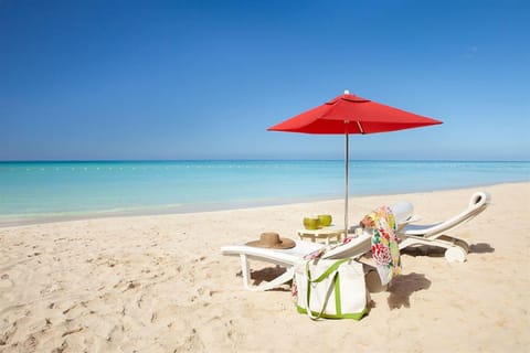 Private beach, white sand, beach umbrellas, beach towels