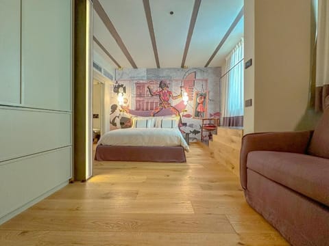 Deluxe Triple Room, Garden View | Minibar, in-room safe, blackout drapes, free WiFi