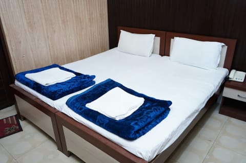 Deluxe Double Room, Multiple Bedrooms, City View | Free WiFi, bed sheets